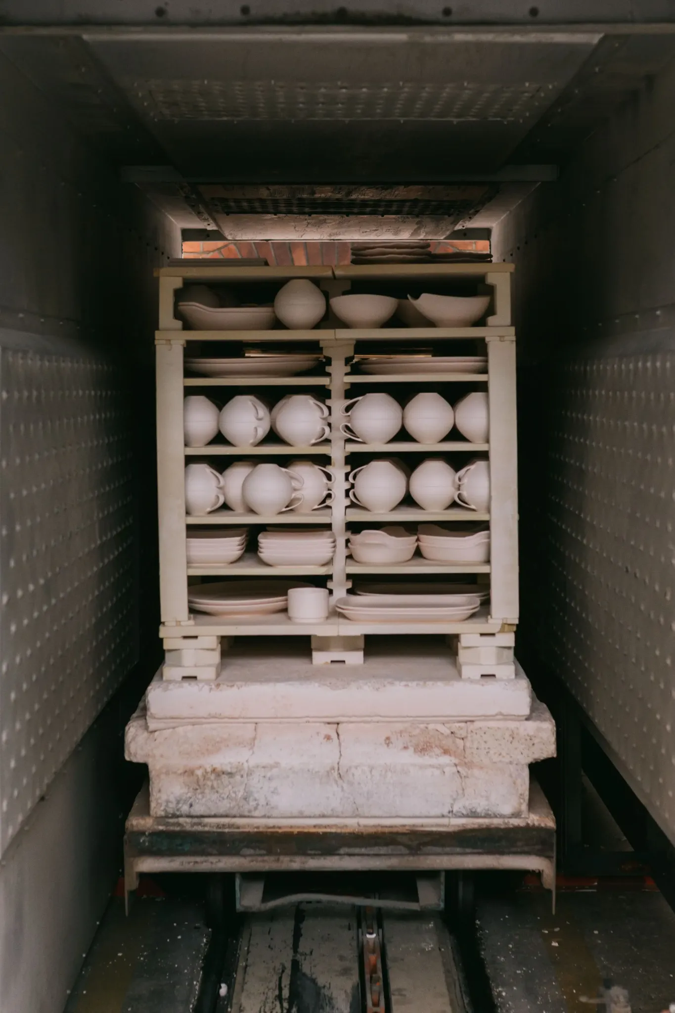 Ceramic tableware loaded inside an industrial kiln